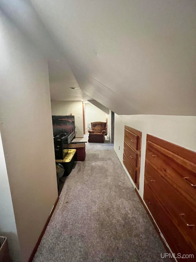 bonus room featuring carpet flooring and lofted ceiling