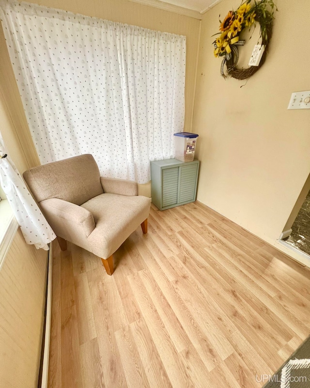 living area with hardwood / wood-style floors