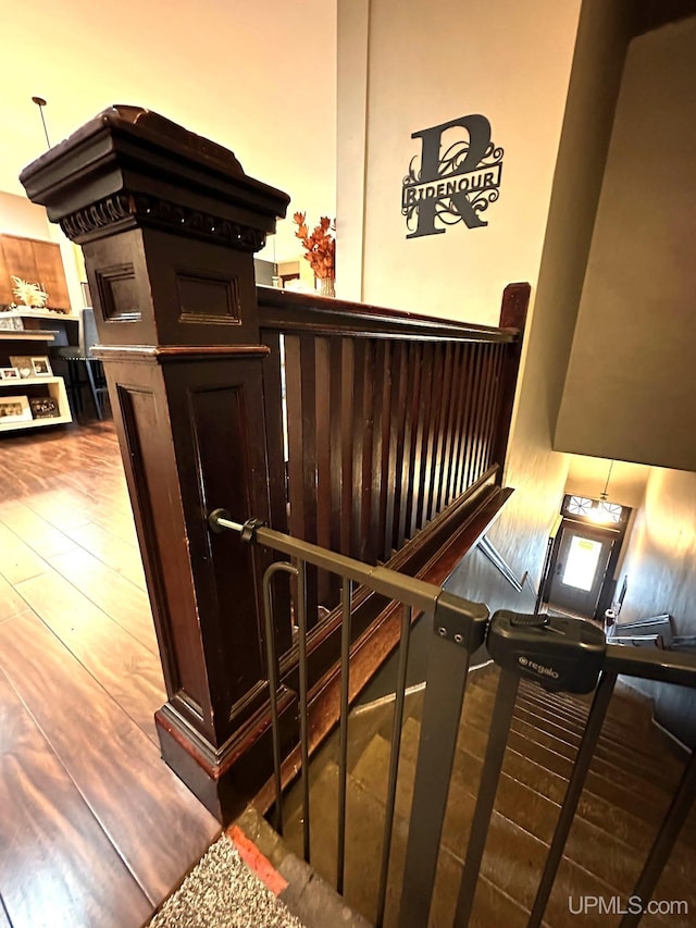 staircase featuring hardwood / wood-style flooring