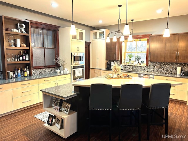318 Iron St, Negaunee, MI 49866 - kitchen featuring open shelves, stainless steel appliances, a kitchen island, a sink, and tasteful backsplash