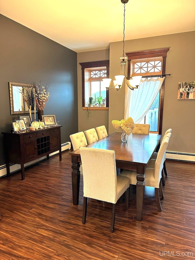 dining room featuring a chandelier, dark hardwood / wood-style floors, and a baseboard heating unit