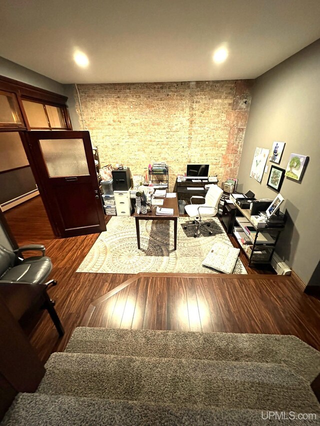 318 Iron St, Negaunee, MI 49866 - living area featuring wood finished floors, an office area, baseboards, recessed lighting, and a baseboard heating unit