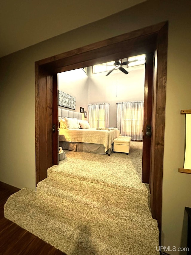 bedroom with hardwood / wood-style floors and ceiling fan