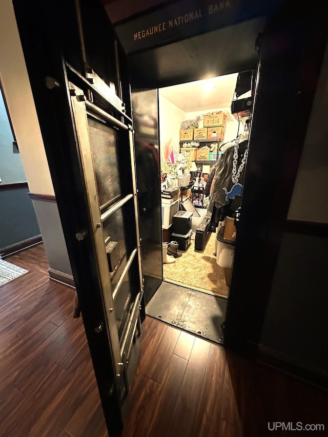 318 Iron St, Negaunee, MI 49866 - corridor featuring hardwood / wood-style floors and baseboards