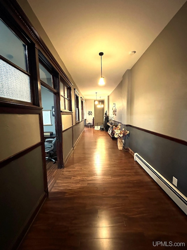 318 Iron St, Negaunee, MI 49866 - hallway with baseboard heating, wood finished floors, baseboards, and an office area