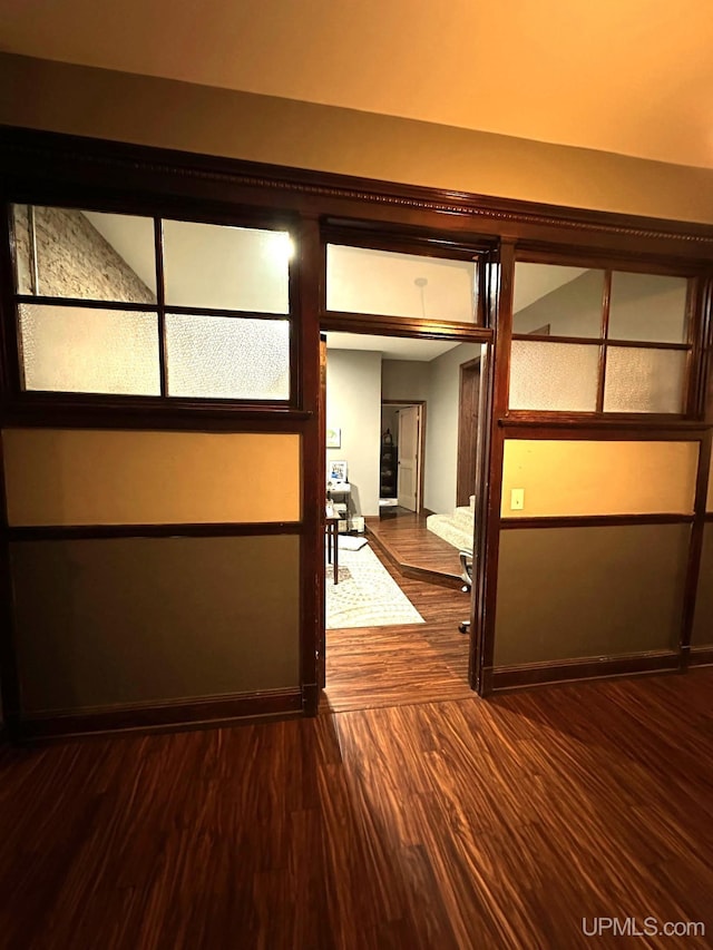 hallway featuring dark hardwood / wood-style floors