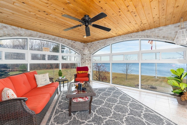 sunroom featuring plenty of natural light, ceiling fan, a water view, and wooden ceiling