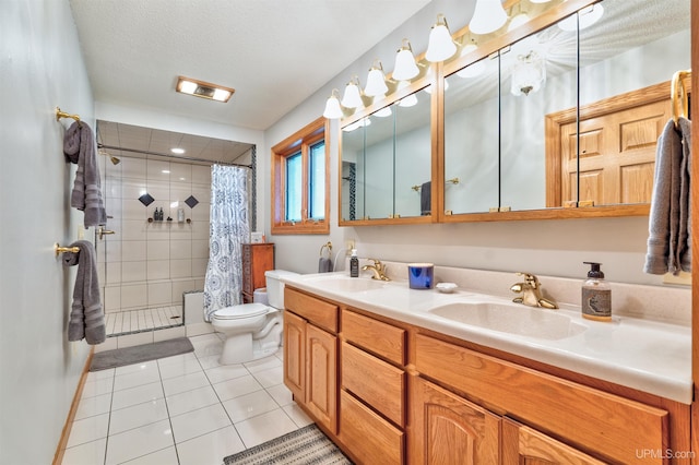 bathroom with tile patterned floors, vanity, toilet, and a shower with shower curtain