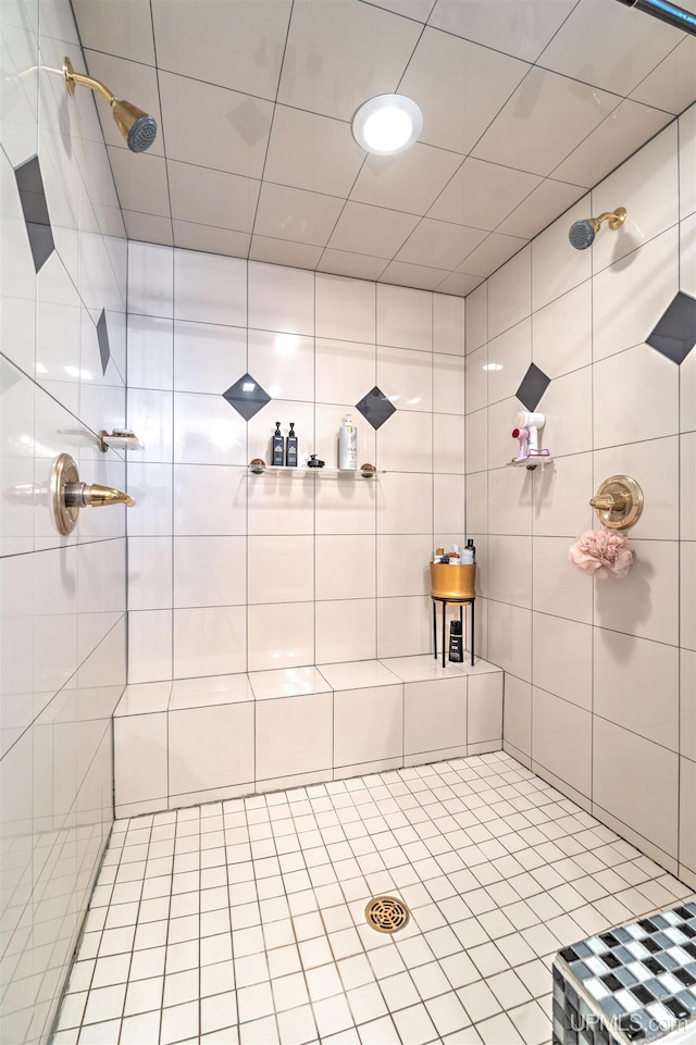 bathroom with tiled shower