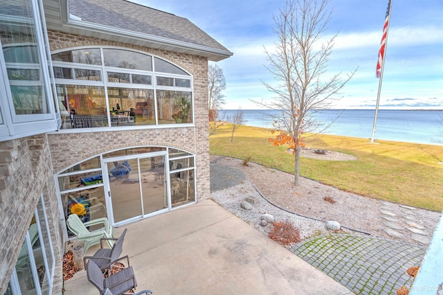 view of patio / terrace with a water view