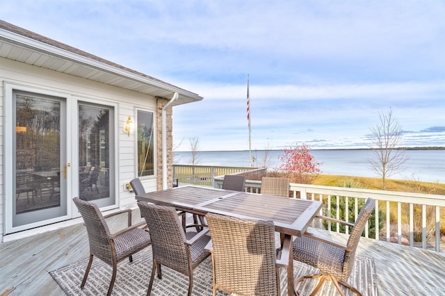 wooden deck featuring a water view