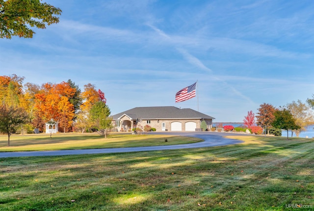 view of property's community with a yard