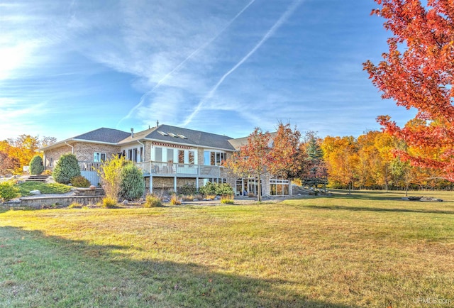 exterior space featuring a yard and a wooden deck