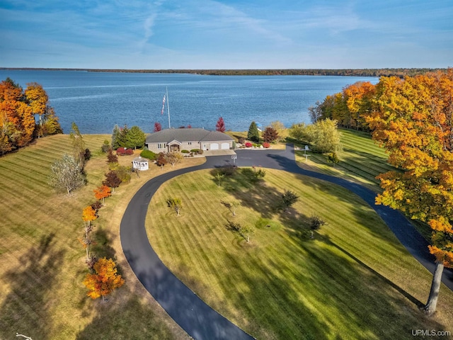 birds eye view of property with a water view