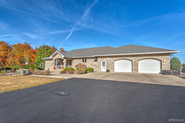 ranch-style house featuring a garage