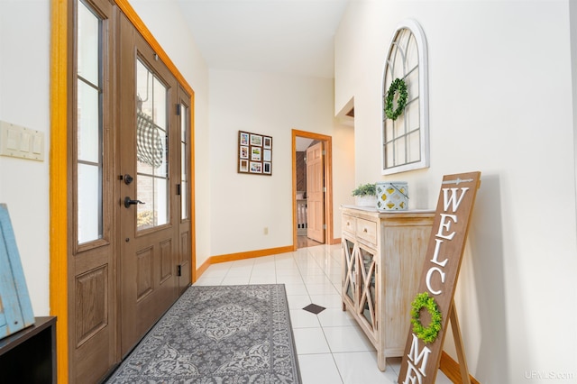 entrance foyer with light tile patterned floors