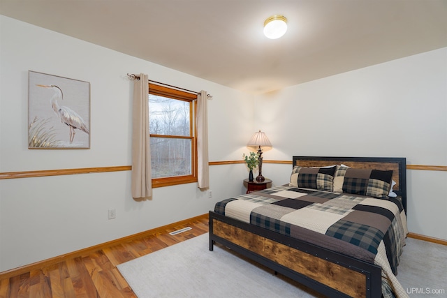 bedroom featuring wood-type flooring