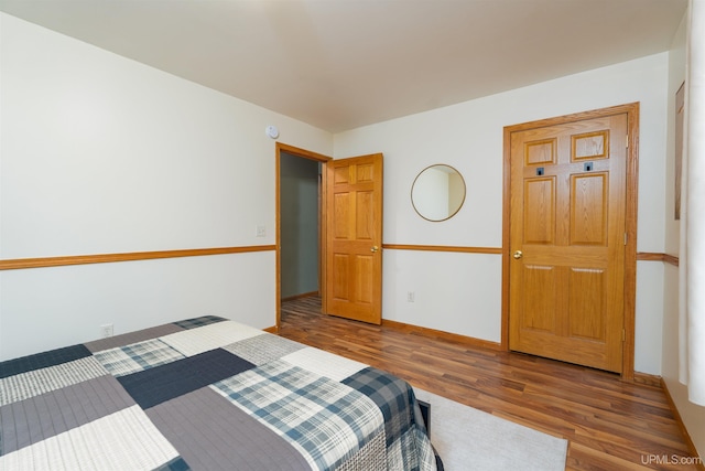 bedroom featuring wood-type flooring