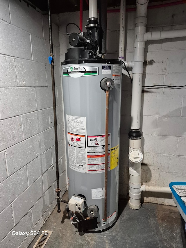 utility room with water heater