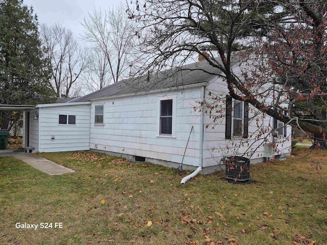 view of property exterior featuring a lawn