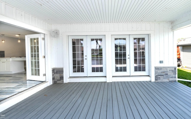 wooden deck featuring french doors