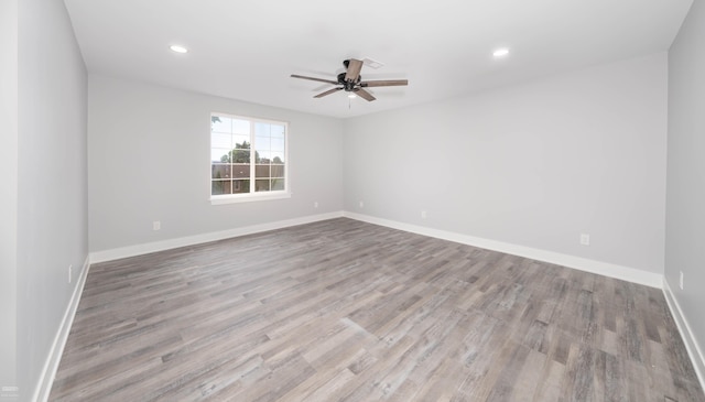 unfurnished room featuring ceiling fan and light hardwood / wood-style flooring