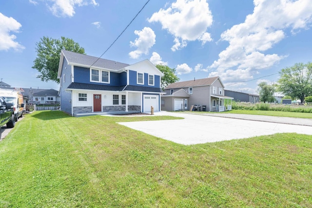 back of property featuring a garage and a yard