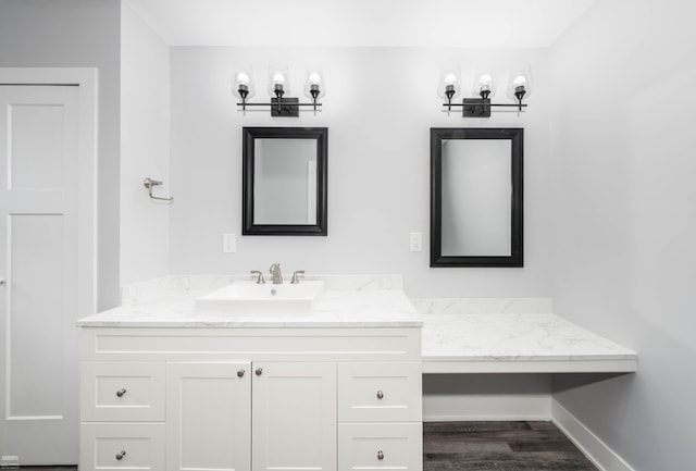 bathroom with vanity and hardwood / wood-style flooring