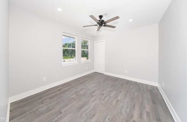 empty room featuring hardwood / wood-style floors and ceiling fan