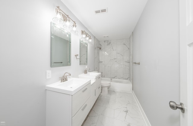 full bathroom with vanity, tiled shower / bath combo, and toilet