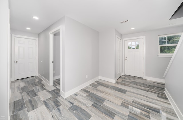 foyer with light hardwood / wood-style floors