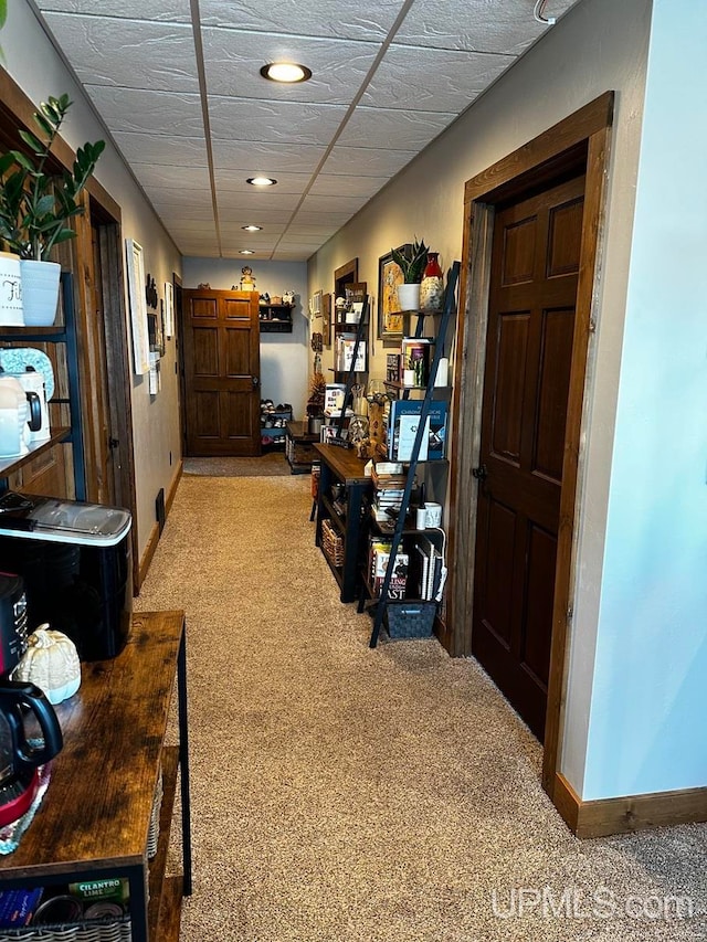 hallway with light colored carpet