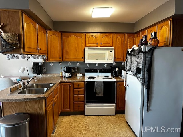 kitchen with sink and white appliances