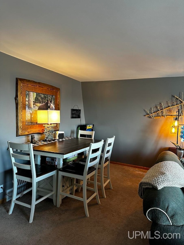 view of carpeted dining area