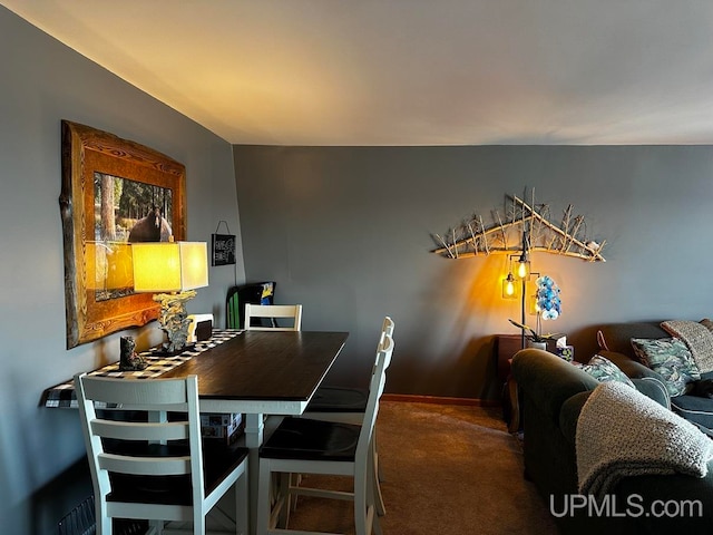 view of carpeted dining area