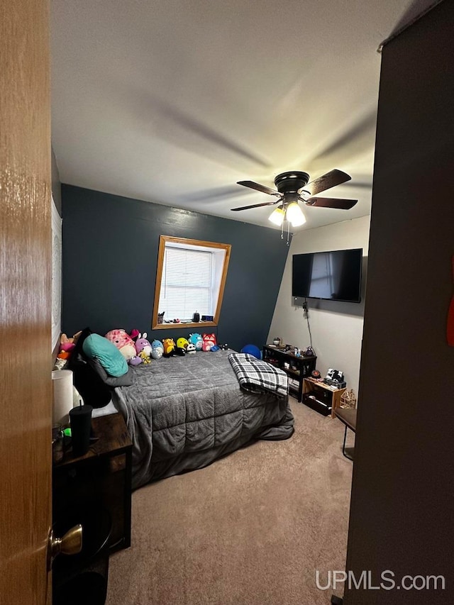 bedroom with ceiling fan and carpet floors