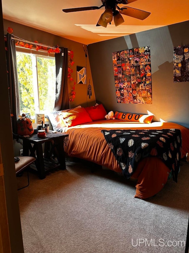 carpeted bedroom featuring ceiling fan