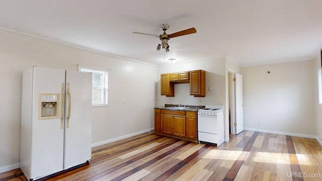 kitchen featuring white appliances, light hardwood / wood-style floors, ceiling fan, and ornamental molding