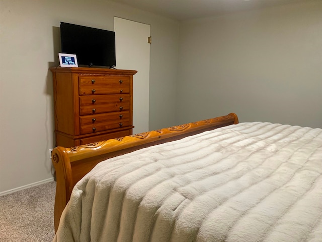 bedroom featuring light colored carpet