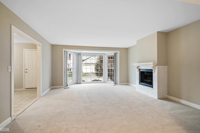 unfurnished living room featuring light carpet and a fireplace