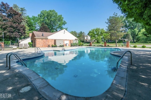 view of swimming pool featuring a patio