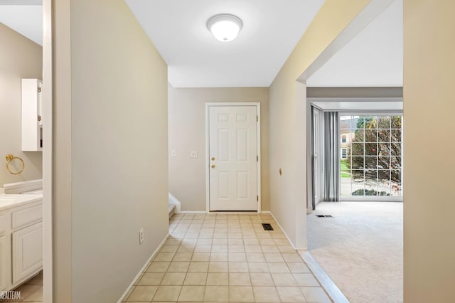 entrance foyer with light carpet