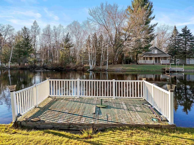 dock area featuring a deck with water view