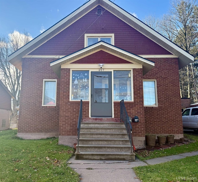 657 Lake Ave, Ironwood, MI 49938 - view of front facade with brick siding