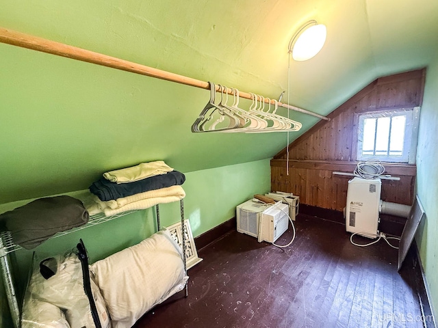 bonus room with dark hardwood / wood-style floors and lofted ceiling