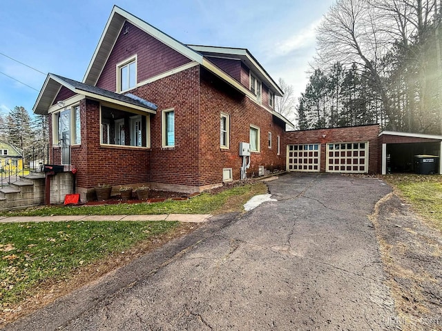 view of side of home with a carport