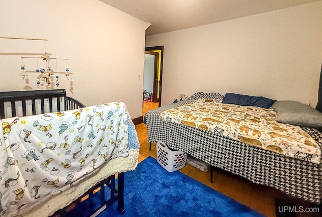 bedroom featuring hardwood / wood-style floors