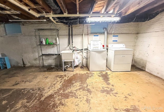 657 Lake Ave, Ironwood, MI 49938 - unfinished below grade area with separate washer and dryer and a sink