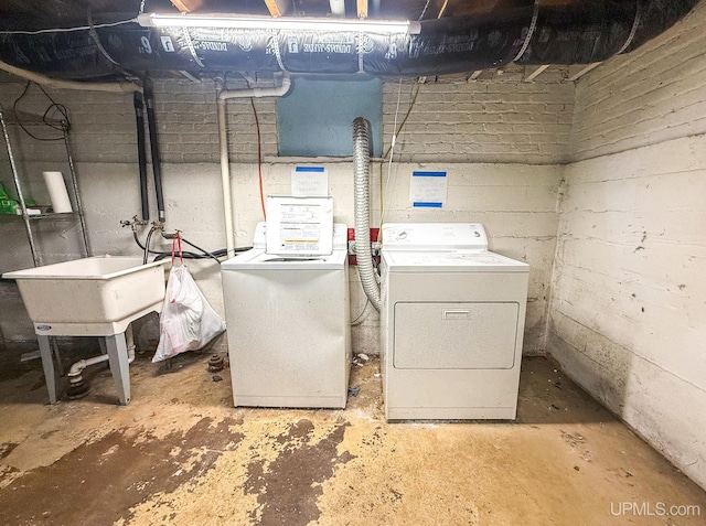 clothes washing area with washer and dryer