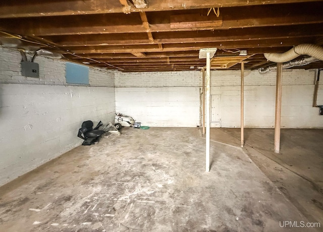 657 Lake Ave, Ironwood, MI 49938 - unfinished below grade area featuring electric panel